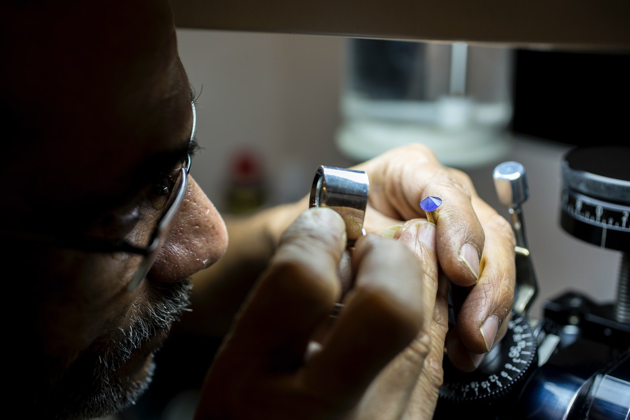 A Jeweler Inspecting a Diamond for Imperfections Like Googles URL Inspection Tool